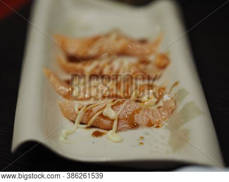 Torched Salmon Aburi Saikyo Sushi With Sweet Sauce On White Plate, Japanese Food