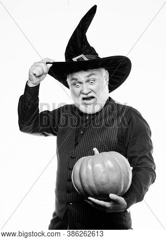 Have A Frightfully Spooky Halloween. Mature Man Magician In Witch Hat. Happy Halloween. Bearded Man 