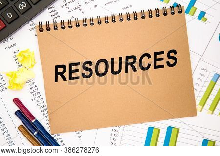 Text Resources On Notepad With Office Tools, Pen On Financial Report . Business And Financial Conzep