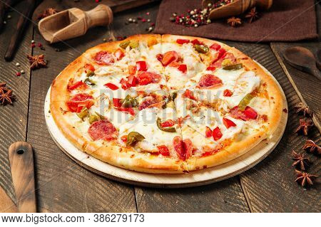 Spicy Mexicano Pizza With Jalapenos On The Wooden Table