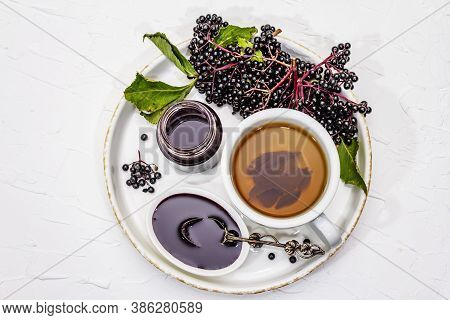Elderberry Jam From Ripe Berries And Hot Tea