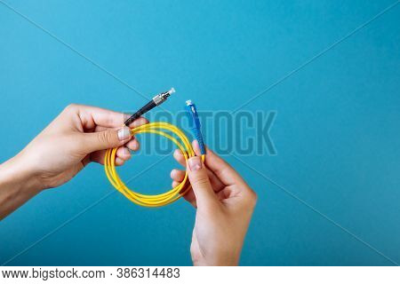 Womans Hands Hold Sc And Fc Connector Fiber Optic Patch Cord Single Mode On Blue Background