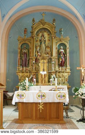 PESCENICA, CROATIA - SEPTEMBER 07, 2013: High altar in the parish church of the Assumption of the Virgin Mary in Pescenica, Croatia