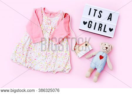 Top View Fashion Trendy Look Of Baby Girl Clothes And Toy Stuff. Babyshower Concept