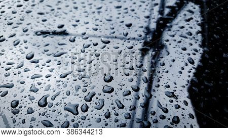 Rain Drop On The Glass Mirror Wall.