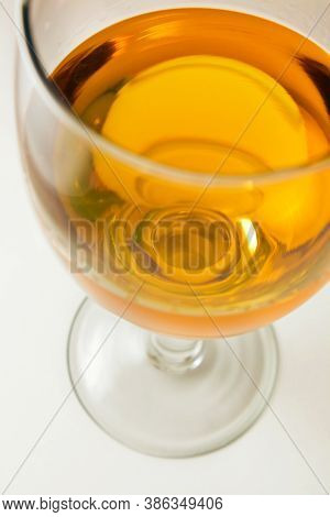 A Glass Of Wine On Isolated White Background.