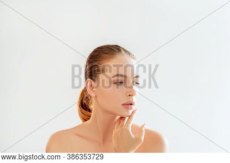 Beauty Procedure. Face Cleansing. Portrait Of Sensual Woman With Perfect Skin Nude Makeup Bare Shoul
