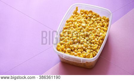 Corn In A Plastic Container For Long-term Storage. Deep Freezing Of Vegetables. Frozen Food Vegetabl