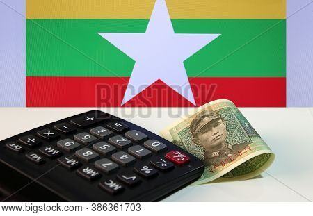 One Of Banknote Currency Myanmar Kyats With Calculator On The White Floor With The Union Of Myanmar 