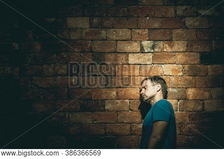 Left Side View Man Under Life Crisis Problems Stand Wearily Leaned Head Against Brown Brick Wall, Cl