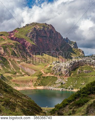Lake, Hiking Track And Clouds Vertical Composition