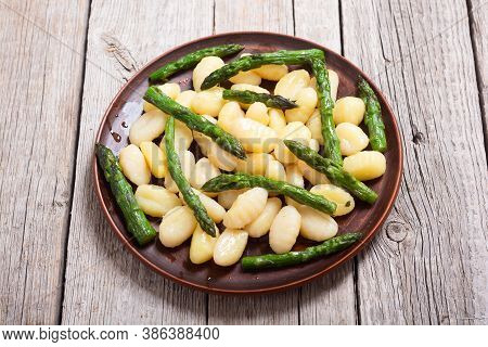Italian Homemade Potatoes Gnocchi With Asparagus
