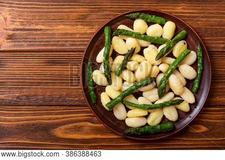 Italian Homemade Potatoes Gnocchi With Asparagus