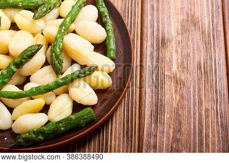 Italian Homemade Potatoes Gnocchi With Asparagus