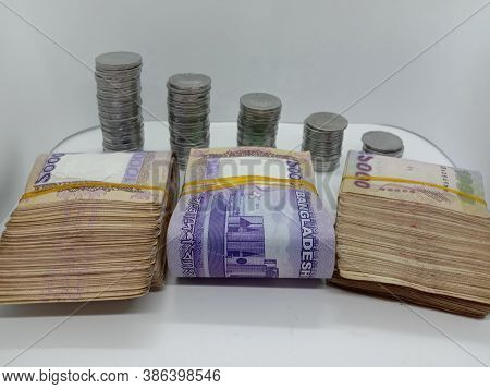 Bangladeshi Bank Note And Coin On White Background