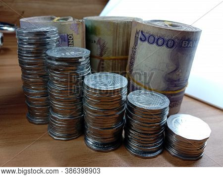 Money Inflation Face With Coin And Note Bundle