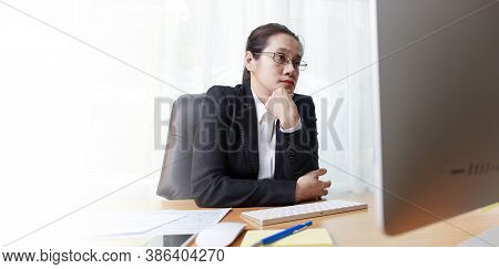 Business Woman Working In Office With Computer Thinking Analysis Stock Chart. Business People Workin