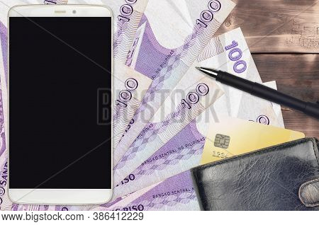 100 Philippine Piso Bills And Smartphone With Purse And Credit Card. E-payments Or E-commerce Concep