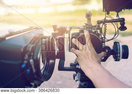 Film Maker Remove Lens Camera For Work. Closeup Hand Of Person Prepare Camera Equipment For Making V