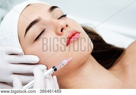 Woman Getting Cosmetic. Injection. Beauty Injections And Cosmetology.  Young Woman In Beauty Salon S