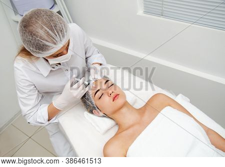 Woman Getting Cosmetic. Injection. Beauty Injections And Cosmetology.  Young Woman In Beauty Salon S