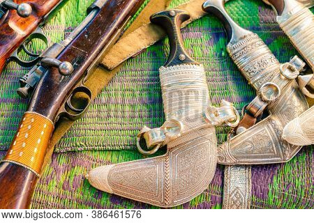 Khanjars and rifles on display at the gun Friday market in Nizwa, Oman