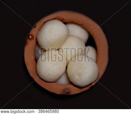 Traditional Indian Bengali Sweet Rasgulla Top Angle View Kept In A Traditional Earthen Pot