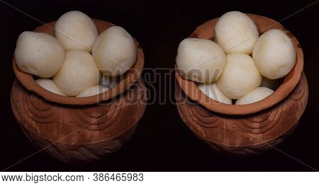 Rasgulla A Traditional Indian Bengali Sweet Served In Two Earthen Pots