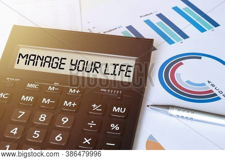 Word Manage Your Life On Calculator. Business And Finance Concept.