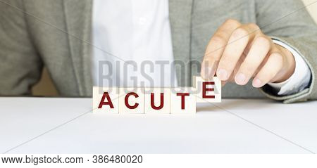 Word Acute Made With Wood Building Blocks. New Normal