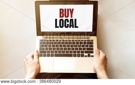 Young Man Checking His Laptop, Top View. Text But Local