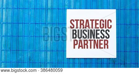 Blank Note Pad With Text Strategic Business Partner On Blue Wooden Background
