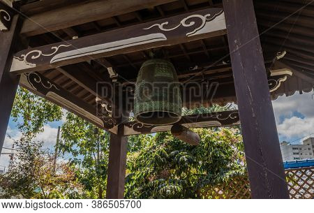 Geumsan, South Korea; September 12, 2020: Low Angle View Of Bell And Striker In Wooden Pavilion At D