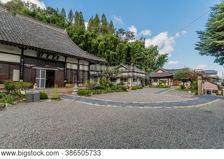Geumsan, South Korea; September 12, 2020: Landscape Of Gravel Lot And Temple Buildings Of Dongguksa 