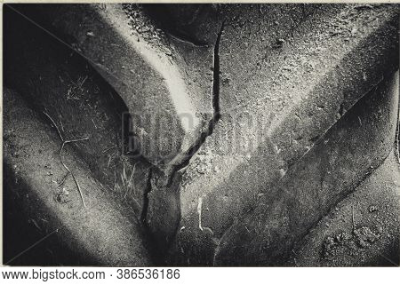 Old Cracked Tractor Tire. Abstract Old Background