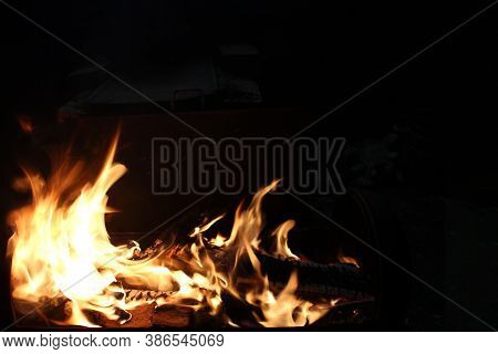 Flame And Fire On A Dark Abstract Background. Infernal Element Of Fire, Copy Of Space. Soft Focus. F