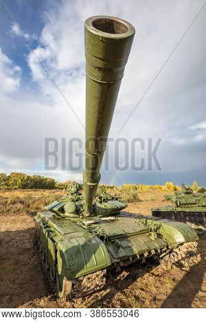 A High Angle Shot Of Russian Tank T-64 In The Field. Cannon Pointing Upwards Straight In The Camera.