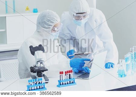 Two Asian Scientist Team Reserch Chemistry Science Tube Experiment Biotech Antibody Sample In Labora