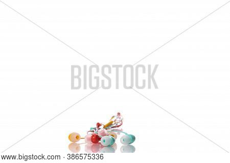 Tangled Colorful Earphones Isolated On White Background. Multicolored Music Accesories, Summer Playl