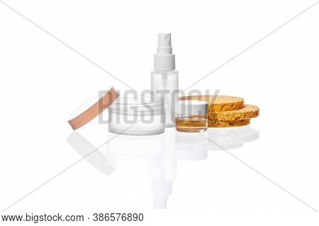 Set Of Transparent Cosmetic Bottle, Jars With Natural Liquids, Organic Facial Scrubbers Isolated On 