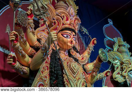Goddess Durga Idol , Durga Puja Festival At Night. Shot Under Colored Light At Howrah, West Bengal, 
