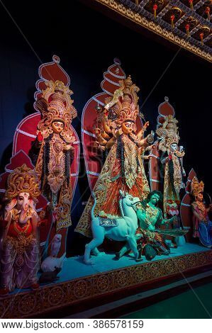 Decorated Durga Puja Pandal With Goddess Durga Idol, Durga Puja Festival At Night. Shot Under Colore