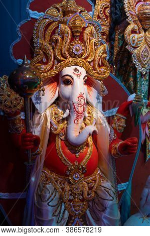 Idol Of God Ganesha , Durga Puja Festival At Night. Shot Under Colored Light At Howrah, West Bengal,