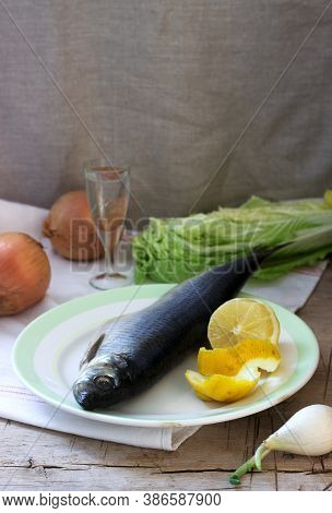 Still Life Of Herring, Lemon, Onion And Vodka. Rustic Style.