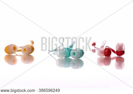 Colorful Earphones Isolated On White Background. Playlist, Podcast, Entertainment Gadget, Relax, Med