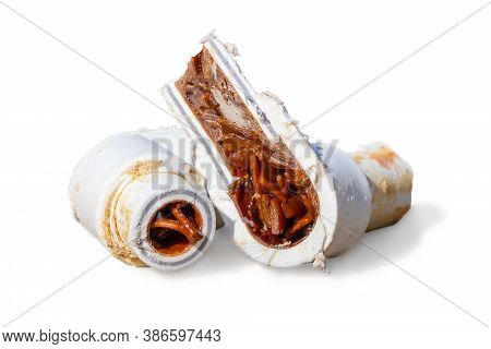 Old Cut Sludge Polypropylene Plumbing Pipes With Red Rust And Limescale. Corrosion, Sludge And Hard 