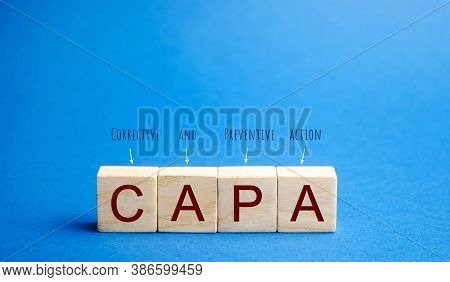 Wooden Blocks With The Word Capa. Corrective And Preventive Action Plans. Business Management Concep