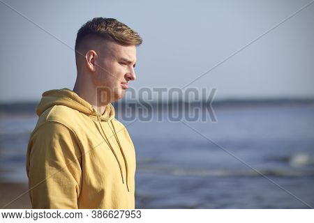 Portrait Of Young Sad Frustrated Man Suffering Because Of Heartbreak On The Beach With A Desperate L