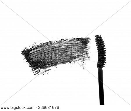 Brush With Smeared Mascara Close Up On A White Background Isolated, Subject Photography For Beauty A