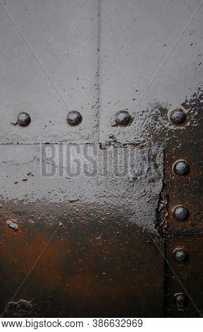 Grunge Background With The Texture Of Wet Gray Metal With Rust